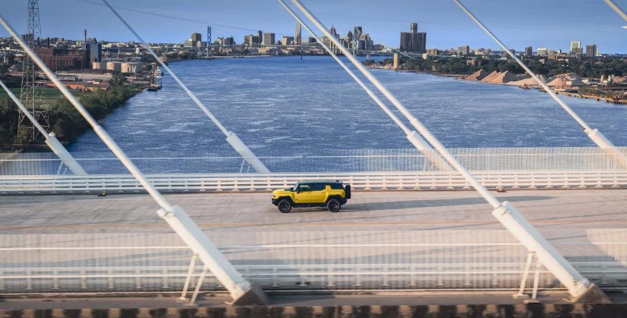 GMC HUMMER EV ICON | 25 driving on a bridge