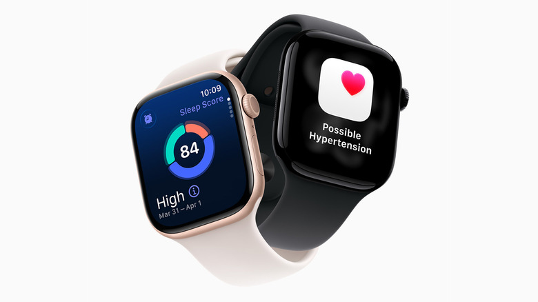 Two Apple Watches, one showing Sleep Score and the other displaying a hypertension alert.