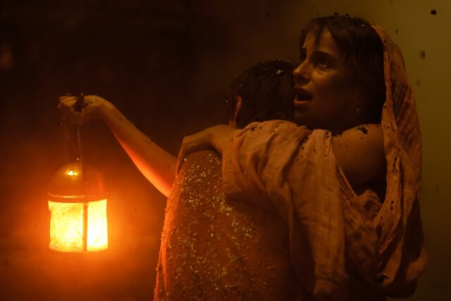 Avianius and his mother Claudia (Madeleine Walker) embrace in the dark, ash-clogged street of Pompeii.