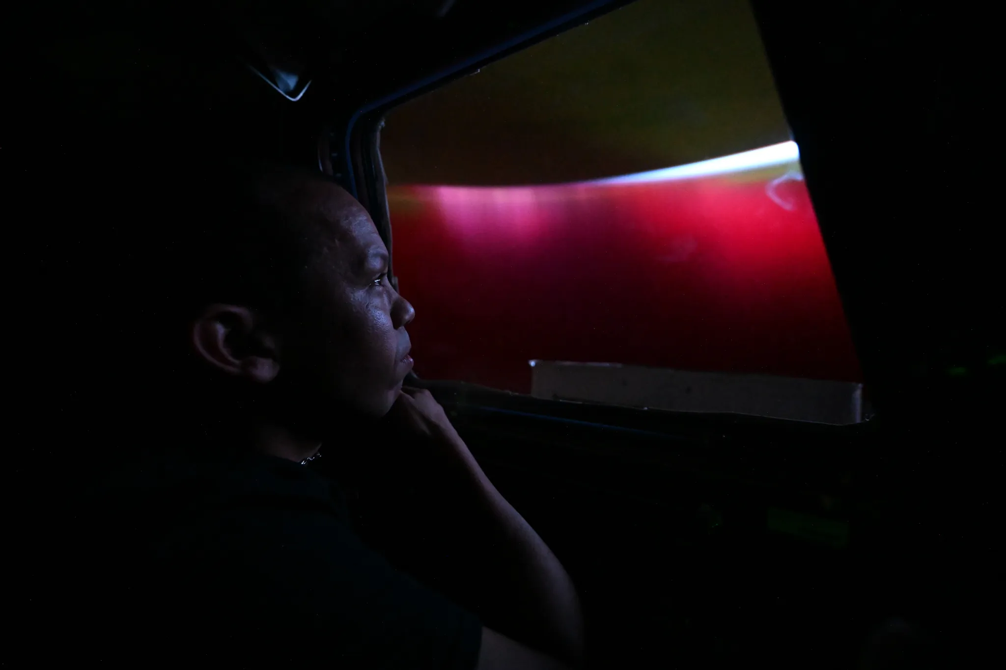 NASA astronaut Chris Williams looks at aurora from cupola